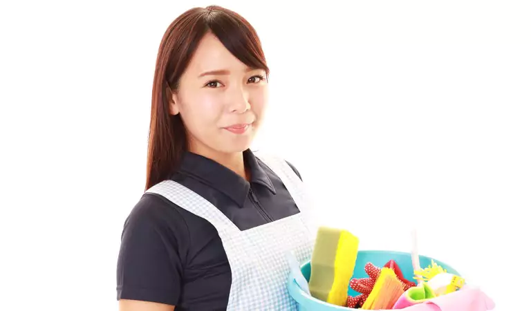 young woman with a bucket full of cleaning supplies