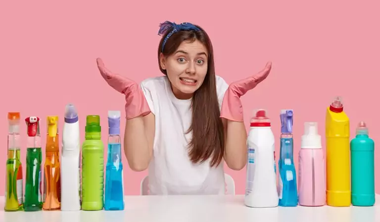 woman with some cleaning products posing for a picture