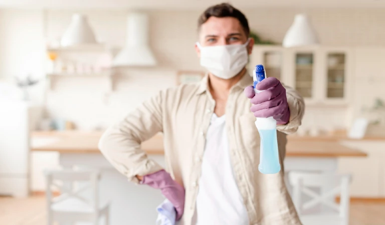 Medium shot man with disinfectant and cleaning