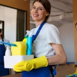 View of professional cleaning service person holding supplies