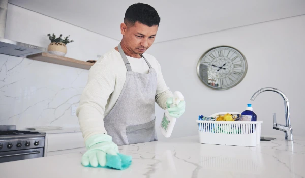 cleaning table in kitchen hygiene or germ and bacteria removal at home