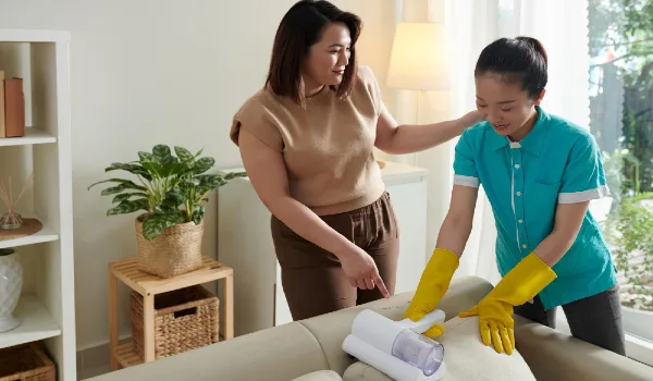 Woman talking to a professional cleaner