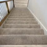 Modern home interior showcasing elegant carpet stairway design
